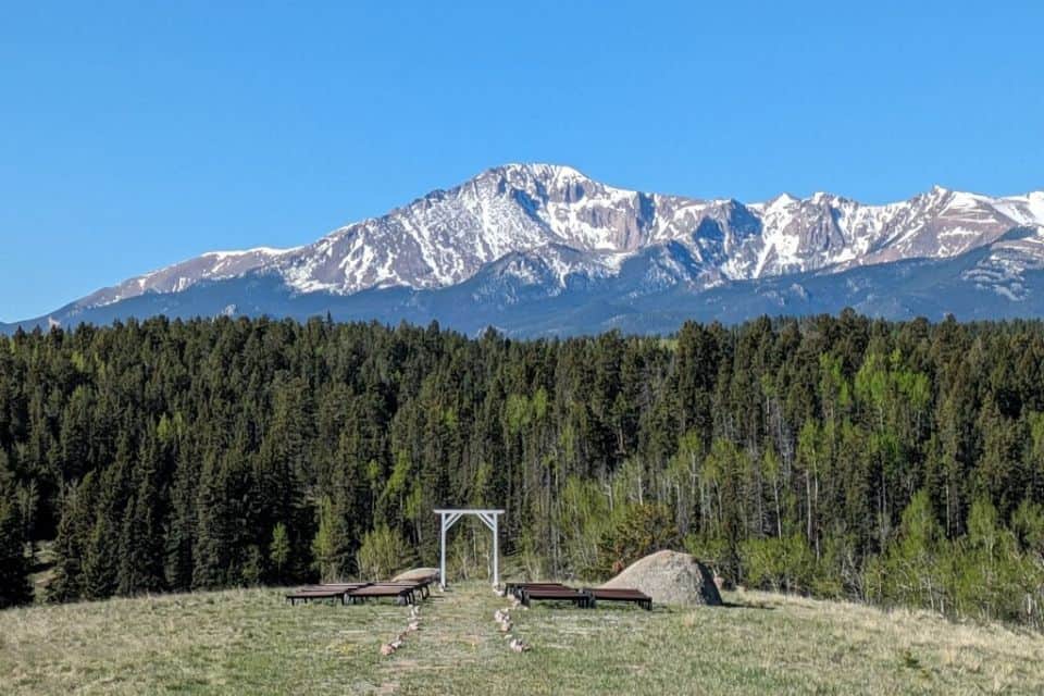 Mountain with a dusting of snow as seen from a distant hill