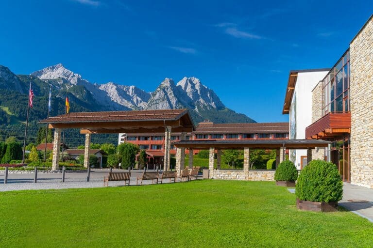 the entry to Edelweiss resort with the surrounding mountains in the background