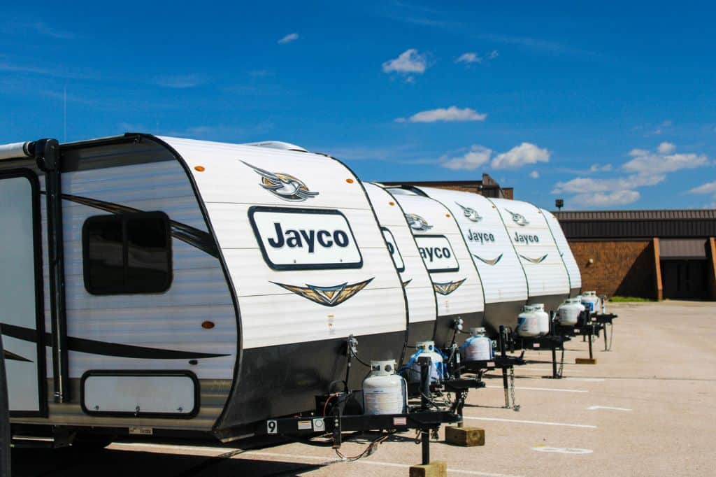 Jayco travel trailers parked in a lot