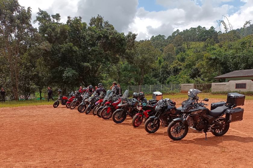 A row of motorcycles lined up side by side