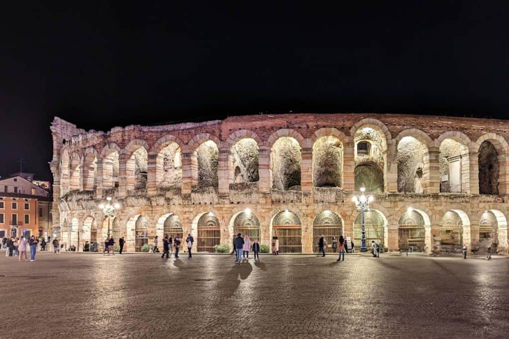 verona's large, well-preserved stone amphitheater sparkles at night