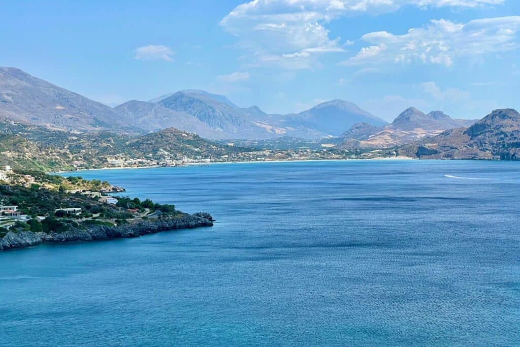 the deep blue mediterranean sea surrounded by mountains