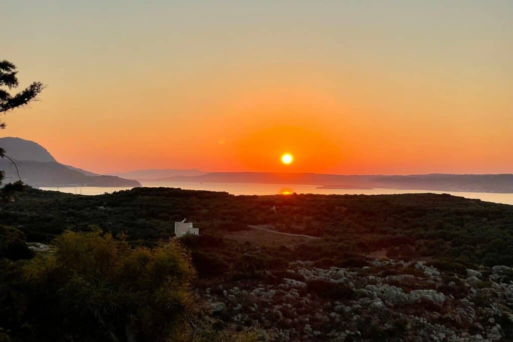 bright orange sunset over the water 